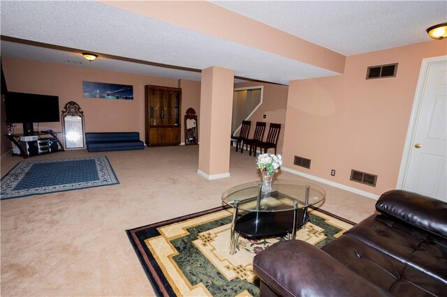 16366 S Hunter St, Olathe, KS 66062 - living room featuring a textured ceiling, baseboards, and carpet flooring