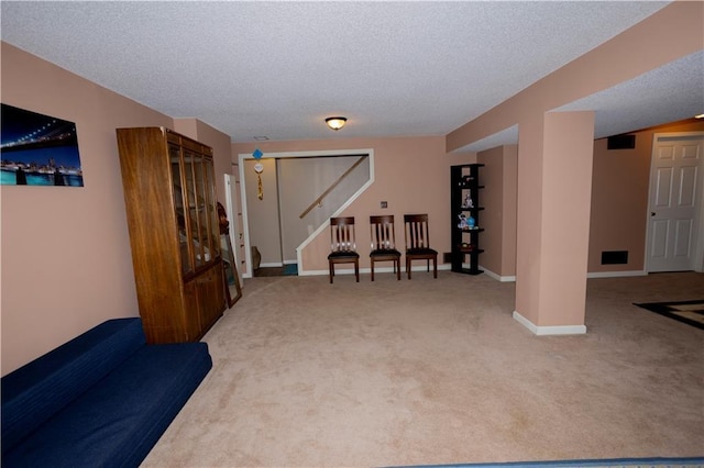 16366 S Hunter St, Olathe, KS 66062 - living area with carpet floors, stairway, a textured ceiling, and baseboards
