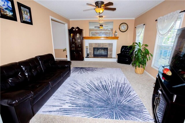 16366 S Hunter St, Olathe, KS 66062 - carpeted living area featuring crown molding, ceiling fan, a tile fireplace, and baseboards