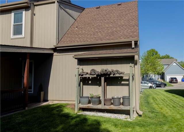 16366 S Hunter St, Olathe, KS 66062 - rear view of house with roof with shingles and a lawn