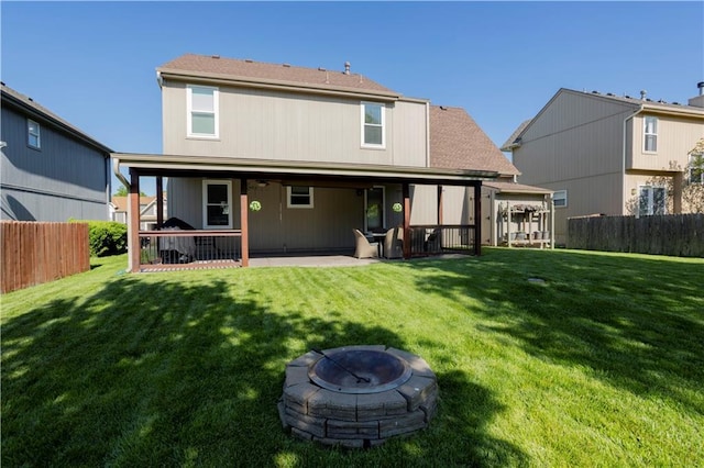 16366 S Hunter St, Olathe, KS 66062 - rear view of property featuring a patio area and an outdoor fire pit