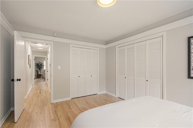 4547 Wyoming St, Kansas City, MO 64111 - bedroom with light wood finished floors, baseboards, and crown molding