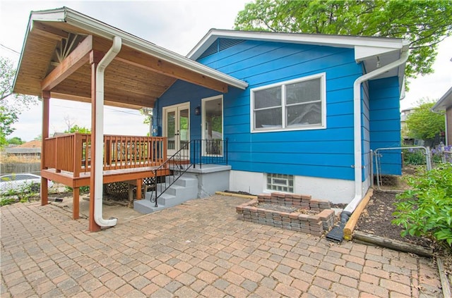 4547 Wyoming St, Kansas City, MO 64111 - back of property featuring fence, french doors, and a patio area