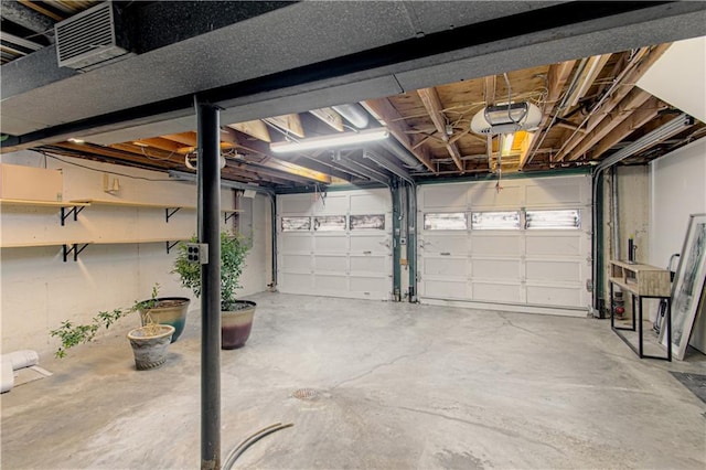 4547 Wyoming St, Kansas City, MO 64111 - garage featuring a garage door opener