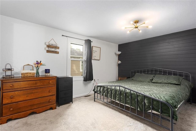 bedroom featuring light colored carpet