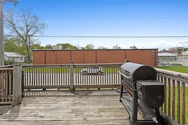 wooden deck featuring grilling area