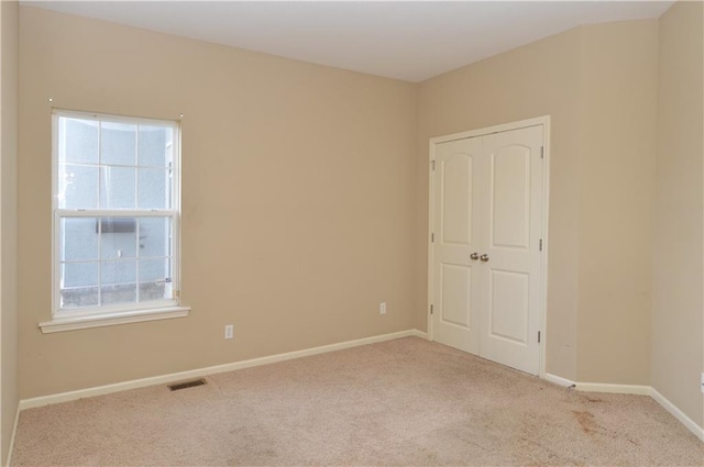 21962 W 116th Ter, Olathe, KS 66061 - unfurnished bedroom with carpet flooring and multiple windows