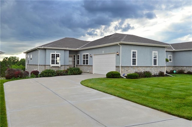 21962 W 116th Ter, Olathe, KS 66061 - view of front of property featuring stucco siding, stone siding, concrete driveway, a front lawn, and a garage