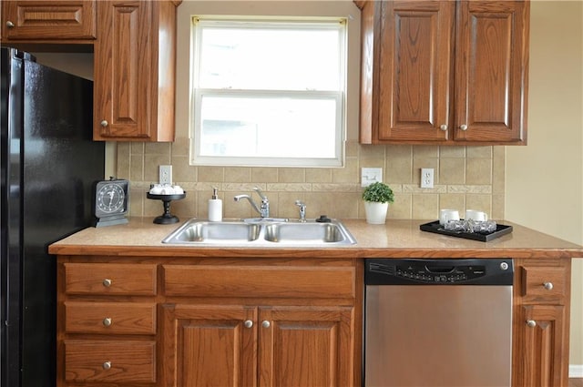 21962 W 116th Ter, Olathe, KS 66061 - kitchen with dishwasher, freestanding refrigerator, tasteful backsplash, and light countertops