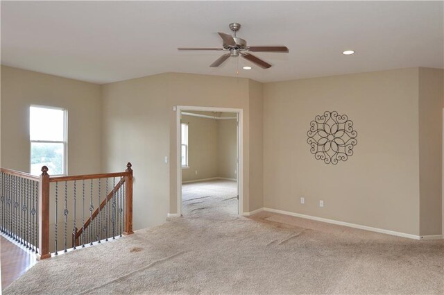 21962 W 116th Ter, Olathe, KS 66061 - empty room with ceiling fan, carpet flooring, plenty of natural light, and recessed lighting