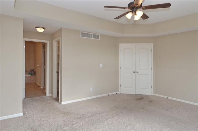21962 W 116th Ter, Olathe, KS 66061 - unfurnished bedroom with carpet, a closet, and a ceiling fan