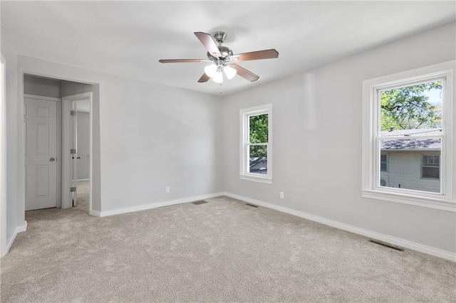 522 E Fair Ave, Independence, MO 64055 - empty room featuring light colored carpet, baseboards, and ceiling fan