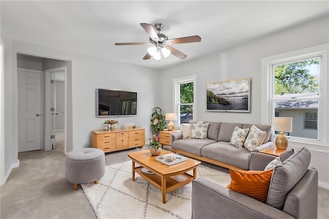 522 E Fair Ave, Independence, MO 64055 - living area with a ceiling fan, light carpet, and baseboards