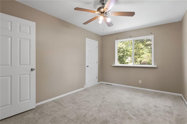 522 E Fair Ave, Independence, MO 64055 - unfurnished room featuring carpet floors, baseboards, and ceiling fan