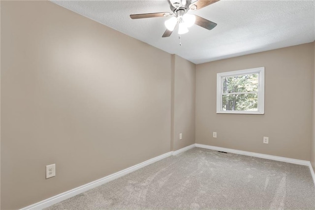 522 E Fair Ave, Independence, MO 64055 - unfurnished room featuring baseboards, a ceiling fan, light colored carpet, and a textured ceiling