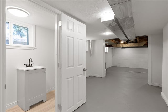 522 E Fair Ave, Independence, MO 64055 - basement with a sink, healthy amount of natural light, and baseboards