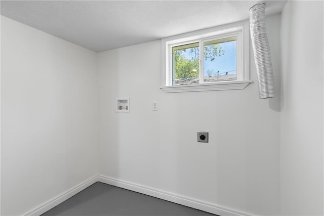 522 E Fair Ave, Independence, MO 64055 - laundry area with hookup for an electric dryer, washer hookup, baseboards, and a textured ceiling