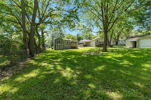 522 E Fair Ave, Independence, MO 64055 - view of yard with a garage