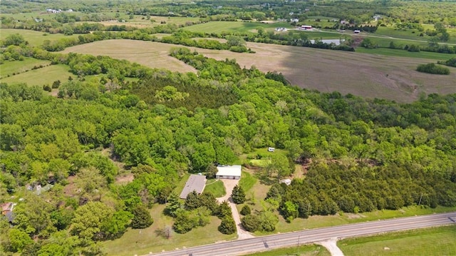 view of property location featuring a heavily wooded area