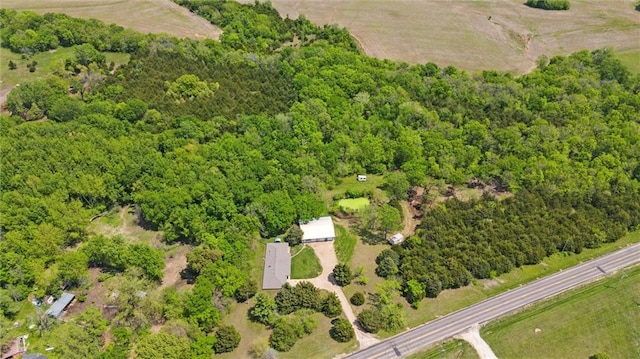aerial overview of property's location featuring a heavily wooded area