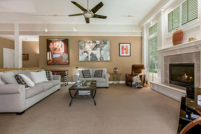 living room with carpet flooring, a ceiling fan, and baseboards