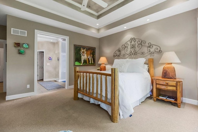 bedroom featuring carpet, a raised ceiling, baseboards, crown molding, and recessed lighting