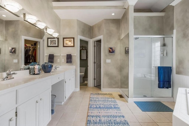 full bathroom with toilet, a shower stall, tile patterned floors, and double vanity
