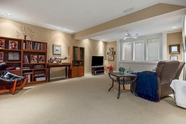 living area with carpet, a ceiling fan, crown molding, and recessed lighting