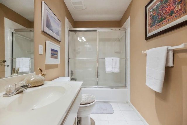 full bathroom with toilet, tile patterned flooring, vanity, and shower / bath combination with glass door