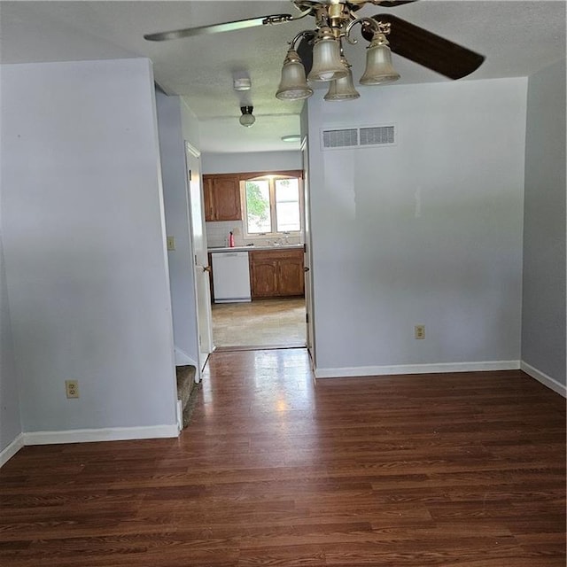 8413-8415 E 170th St, Belton, MO 64012 - empty room featuring wood finished floors, ceiling fan, and baseboards