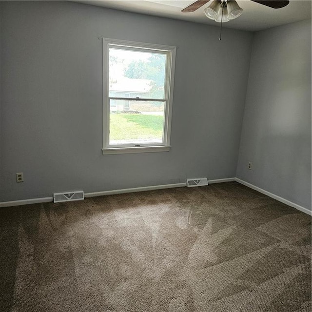 8413-8415 E 170th St, Belton, MO 64012 - unfurnished room with a ceiling fan, dark colored carpet, and baseboards