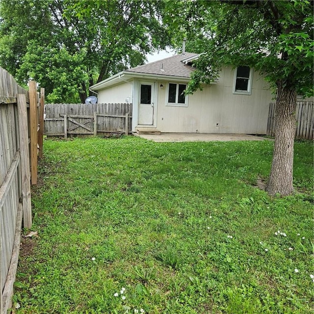8413-8415 E 170th St, Belton, MO 64012 - back of property with a patio and a shingled roof