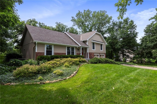 16280 Nall Ave, Stilwell, KS 66085 - tri-level home featuring brick siding, an attached garage, a front lawn, and a shingled roof