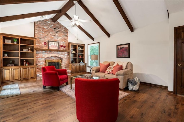 16280 Nall Ave, Stilwell, KS 66085 - living room with ceiling fan, wood finished floors, beam ceiling, a brick fireplace, and high vaulted ceiling