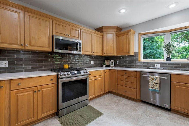 16280 Nall Ave, Stilwell, KS 66085 - kitchen featuring stainless steel appliances, light countertops, decorative backsplash, and recessed lighting