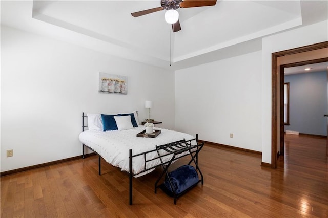 16280 Nall Ave, Stilwell, KS 66085 - bedroom with a raised ceiling, wood finished floors, and ceiling fan