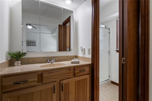 16280 Nall Ave, Stilwell, KS 66085 - bathroom with vanity, a stall shower, ceiling fan, and tile patterned floors