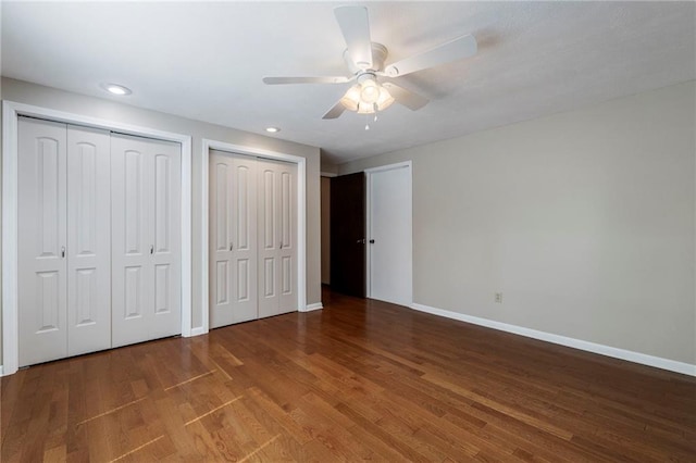 16280 Nall Ave, Stilwell, KS 66085 - unfurnished bedroom featuring two closets, wood finished floors, recessed lighting, and a ceiling fan