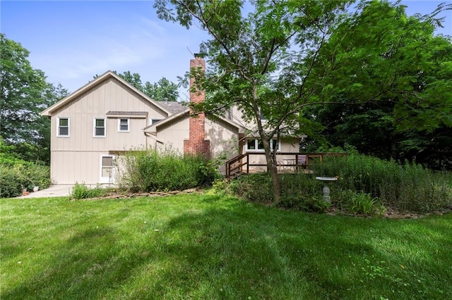 16280 Nall Ave, Stilwell, KS 66085 - rear view of property with a chimney and a yard