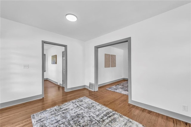 1508 SW Smith St, Blue Springs, MO 64015 - spare room with wood finished floors and baseboards