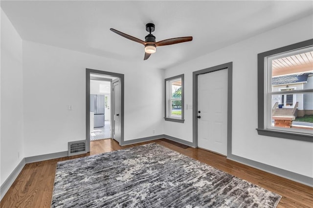 1508 SW Smith St, Blue Springs, MO 64015 - foyer featuring a ceiling fan, wood finished floors, and baseboards