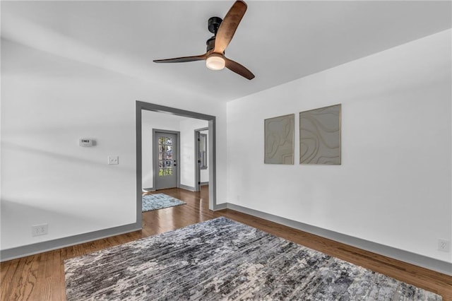 1508 SW Smith St, Blue Springs, MO 64015 - empty room featuring a ceiling fan, baseboards, and wood finished floors