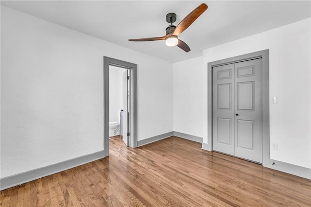 1508 SW Smith St, Blue Springs, MO 64015 - unfurnished room with a ceiling fan, light wood-style flooring, and baseboards