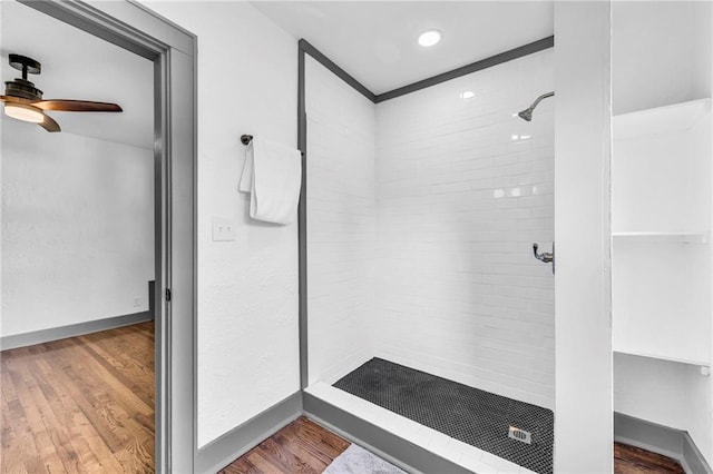 1508 SW Smith St, Blue Springs, MO 64015 - full bathroom featuring a shower stall, ceiling fan, wood finished floors, and baseboards