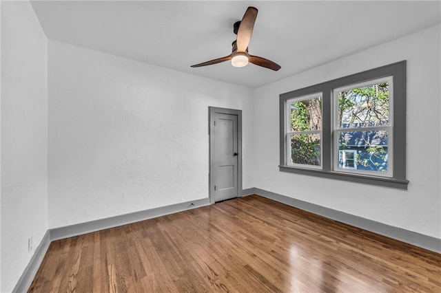 1508 SW Smith St, Blue Springs, MO 64015 - unfurnished room featuring wood finished floors, baseboards, and a ceiling fan