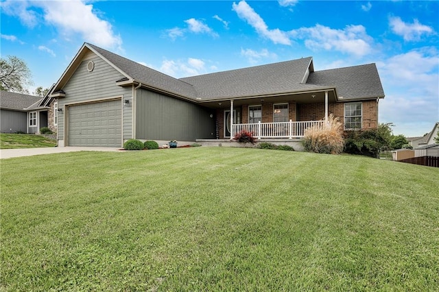 view of front of home featuring covered porch, an attached garage, concrete driveway, a front lawn, and a shingled roof