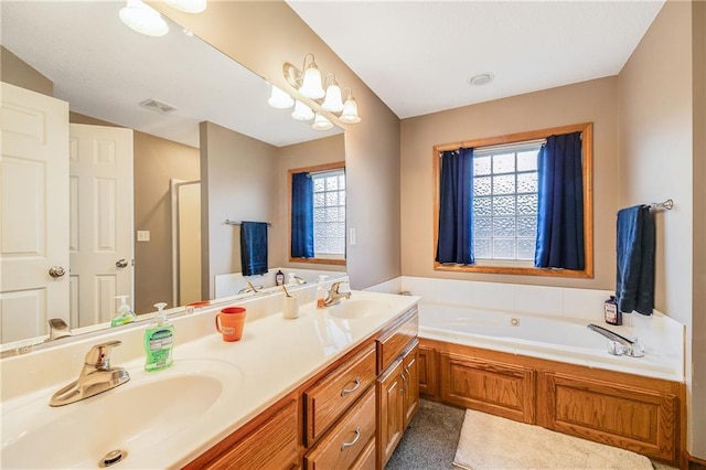 bathroom featuring a garden tub, a shower stall, and double vanity