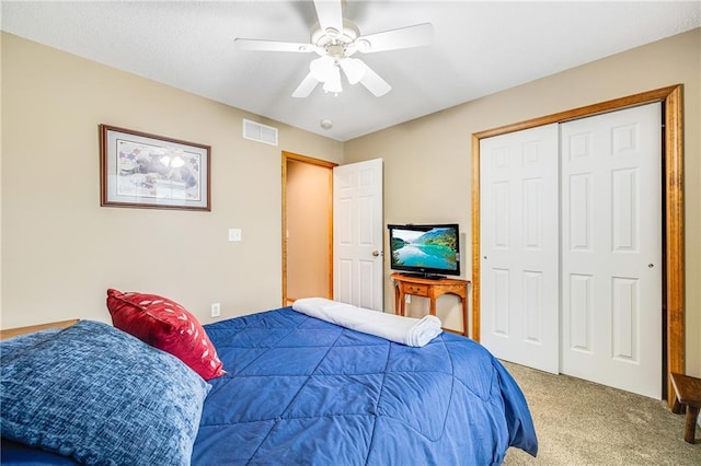 bedroom with carpet floors, a closet, and ceiling fan