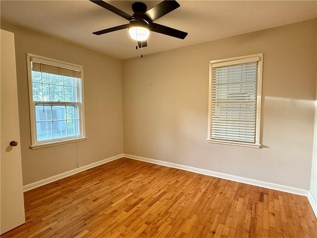 406 Bowen St, Linwood, KS 66052 - unfurnished room with wood finished floors, baseboards, and a ceiling fan