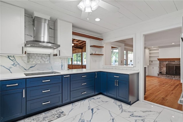 8822 Hadley St, Overland Park, KS 66212 - kitchen with wall chimney exhaust hood, black electric stovetop, light countertops, ornamental molding, and white cabinets